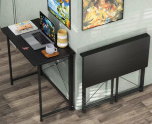 Escritorio plegable pequeño, 80x45x74cm por 34,99€ antes 118€; con pequeña balda por 48,08€.